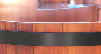 Powder coated hoop and beautifully finished cedar edge of a Lignum Hot Tub, with the stainless Tub Sub heater.